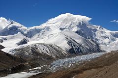
Shishapangma North ABC at the lower left near the ice pinnacles of the Shishapangma Glacier, Phola Gangchen on the left and Shishapangma North Face partially in the clouds from the ridge (5790m) above Shishapangma North Advanced Base Camp.
